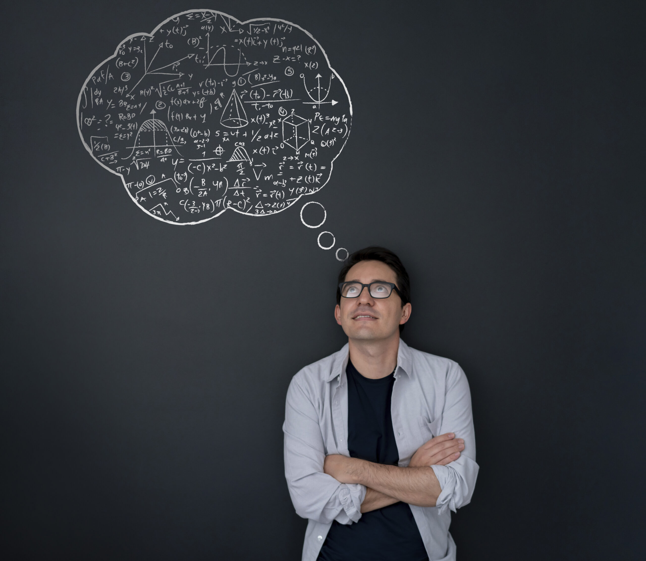 A person thinking in front of a blackboard with a brain drawn on it.